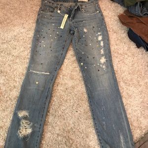 Studded ripped jeans
